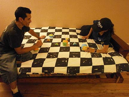 Two people playing Quilt Hopper